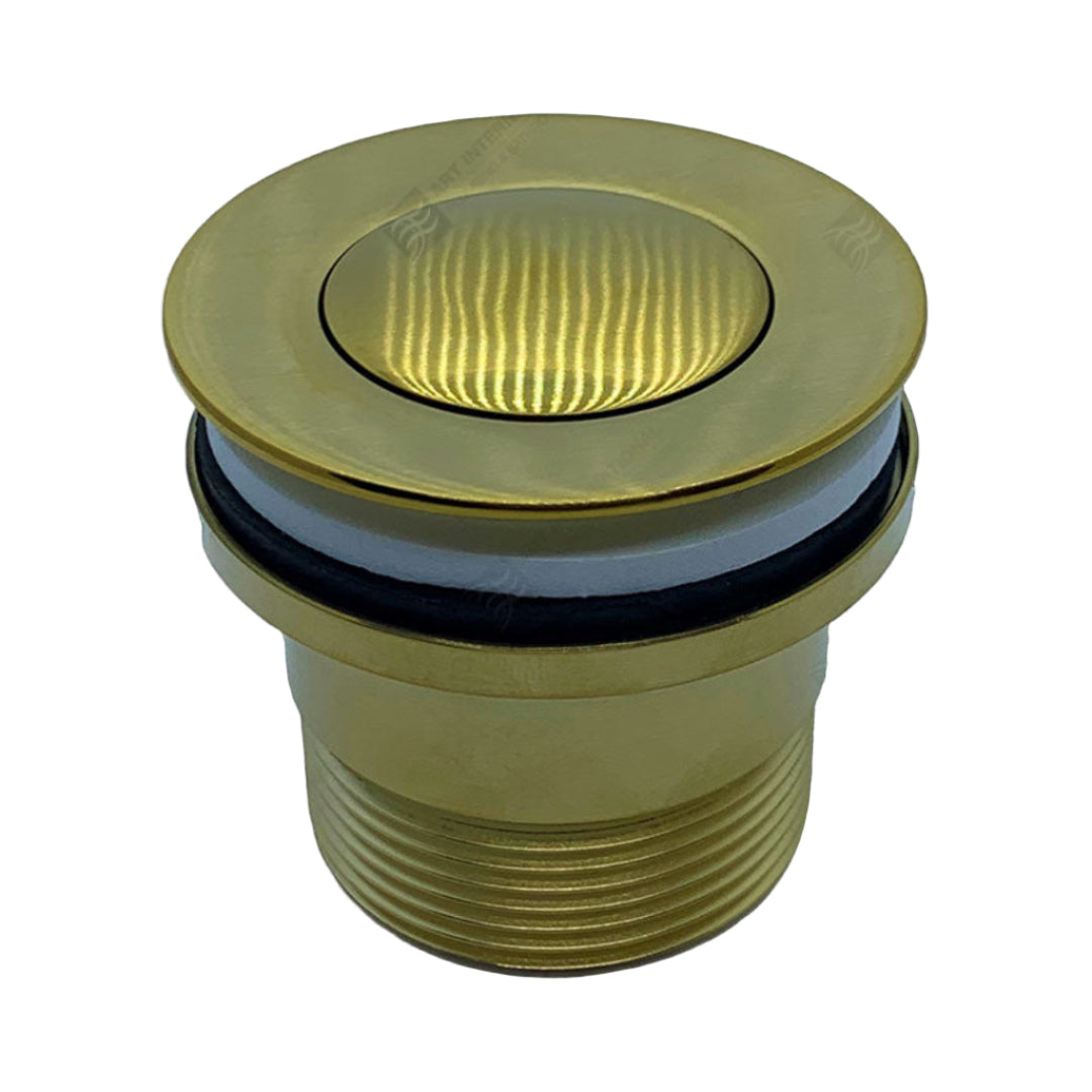 A gold-colored brass pop-up plug and waste for a bath or basin.