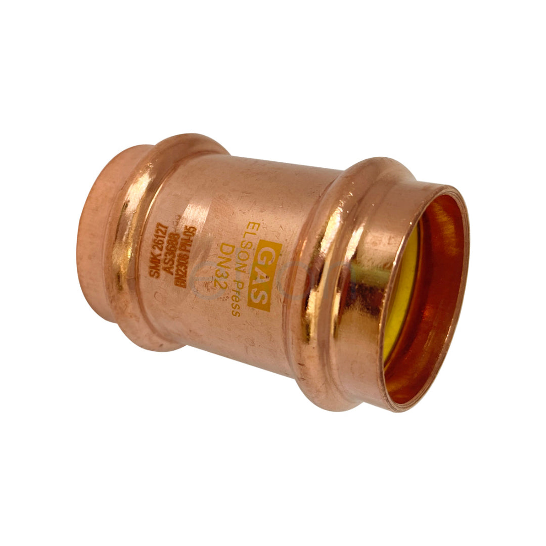 Bronze pipe fitting with yellow center on a white background