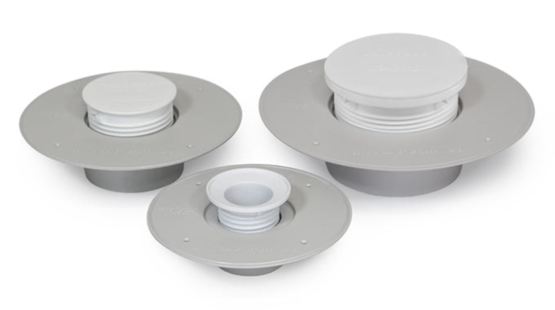 Three Cyclone floor waste flanges, two square and one round, with white adjustable spigots, against a grey background.