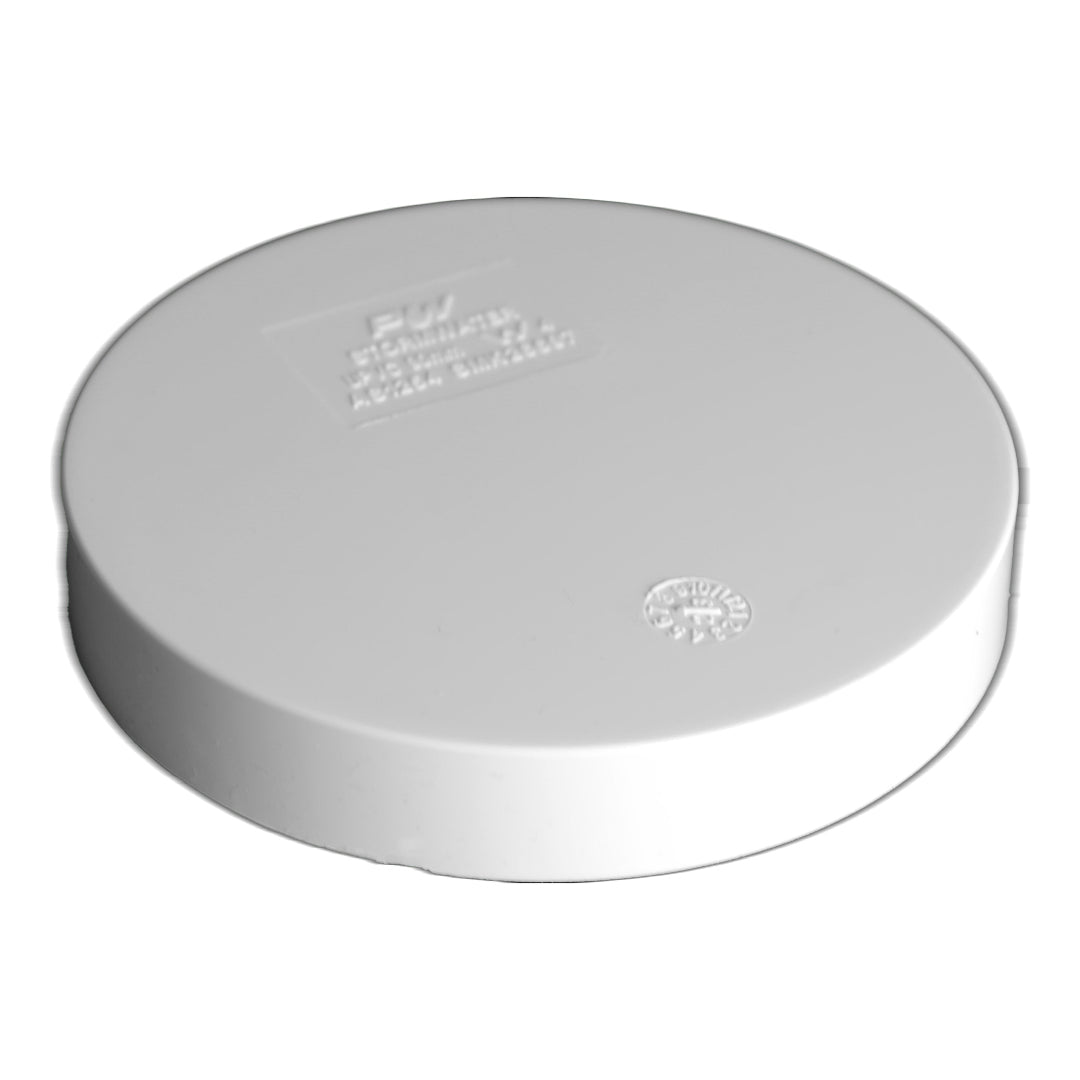 A white PVC push on cap for plumbing.