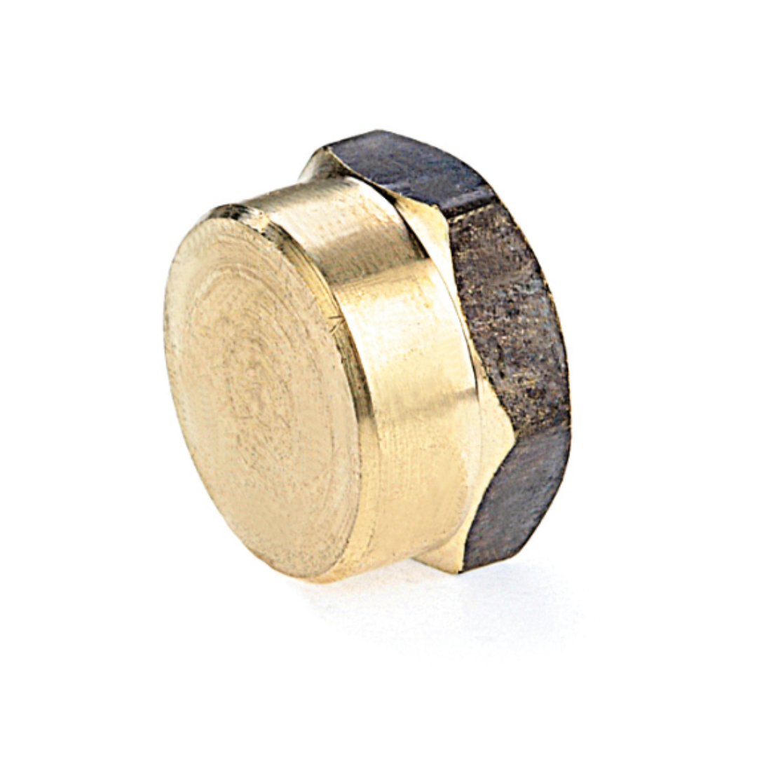 A gold-colored metal plumbing cap with a central black rubber part for sealing.