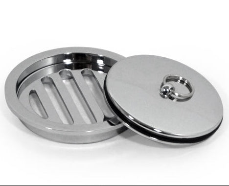 Chrome metal sink drain cover with a ring on a white background