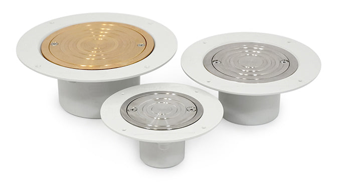 Three different types of PVC drain covers in silver, gold, and gray colors, with a stainless steel finish on the top and a brass base.