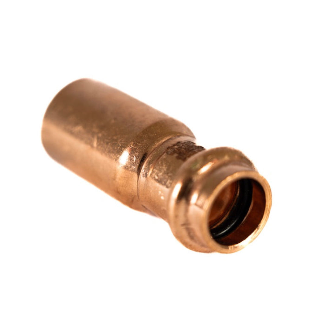 A copper press water fitting reducer, with a V-profile, for pipe joining.