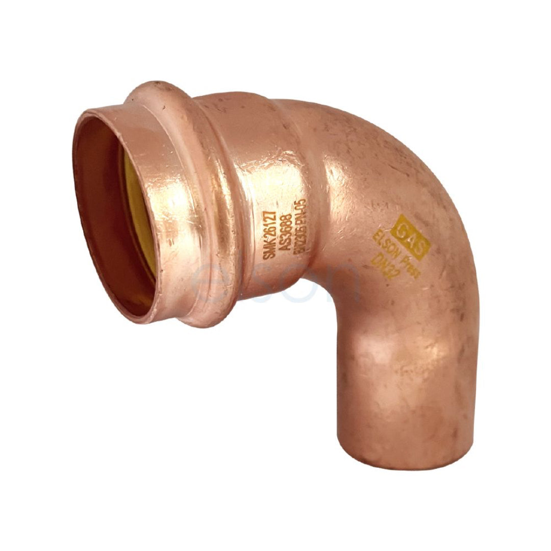 Copper elbow pipe fitting on a white background