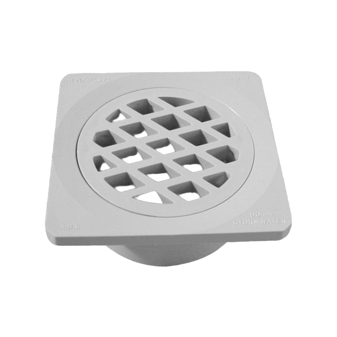 A square floor drain grate with a geometric pattern.