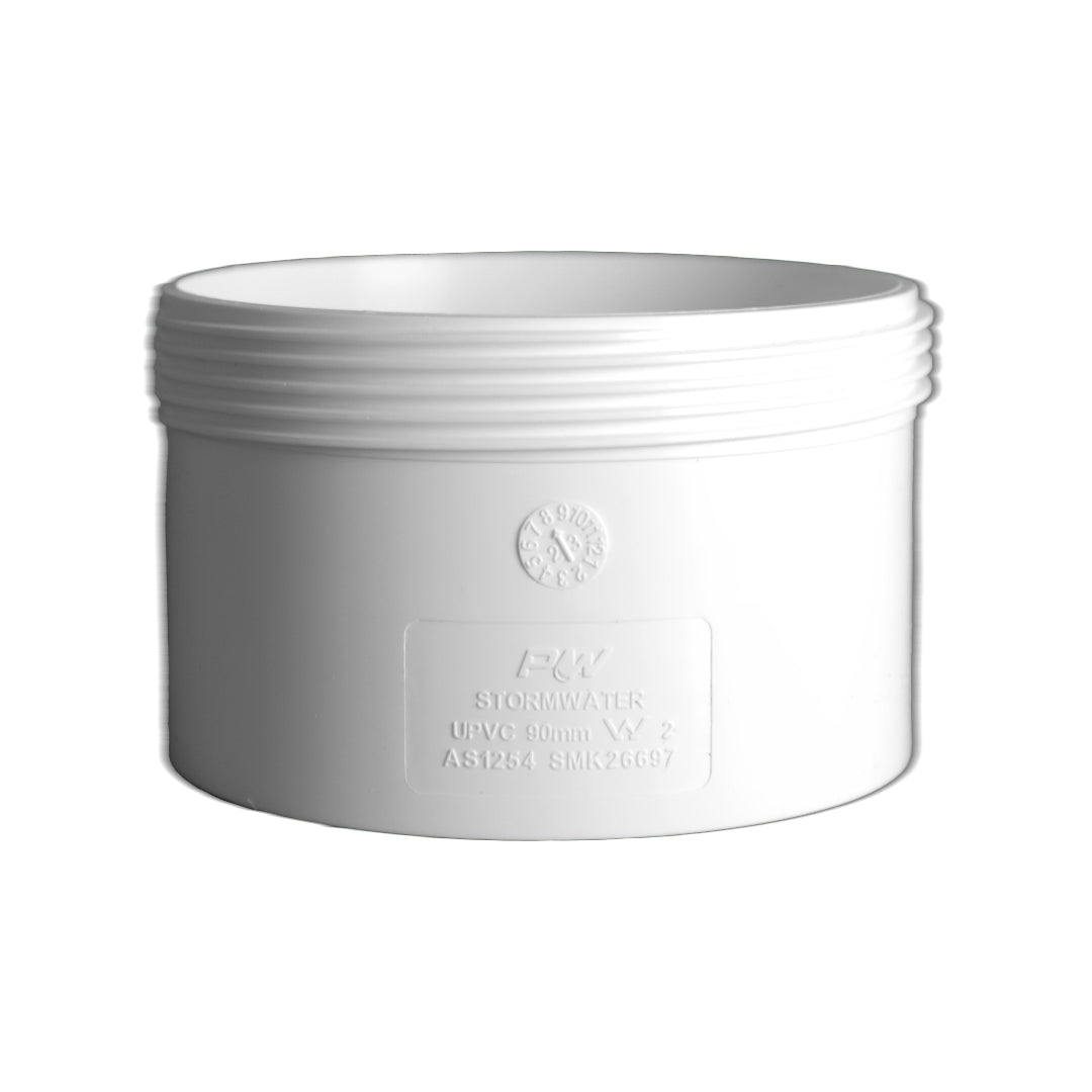 A white PVC stormwater access coupling with threaded connections for plumbing.