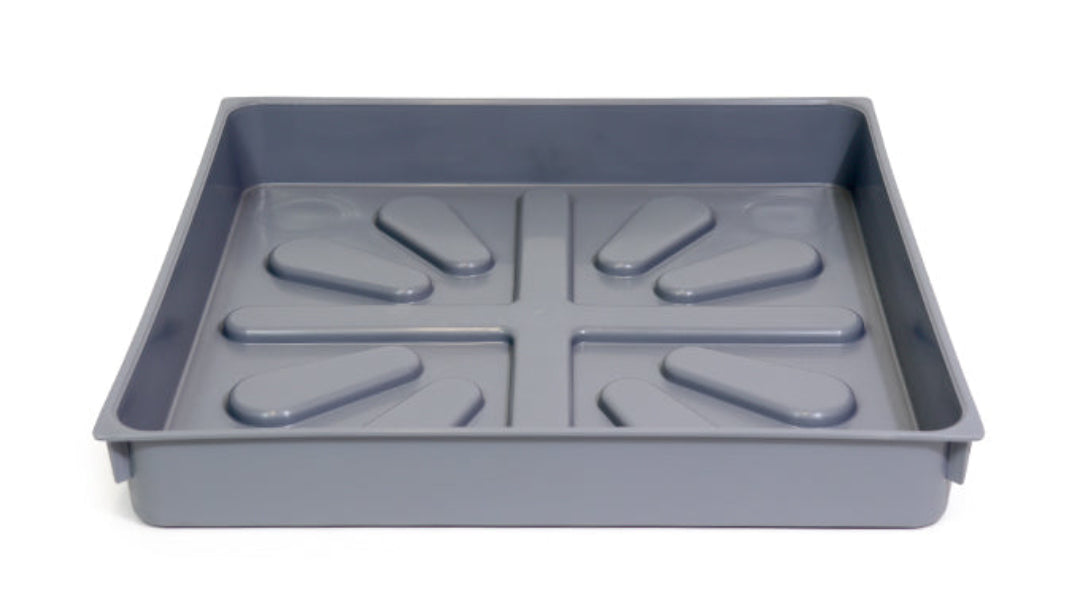 A gray plastic hot water cylinder tray with multiple protruding sections designed to catch leaks.