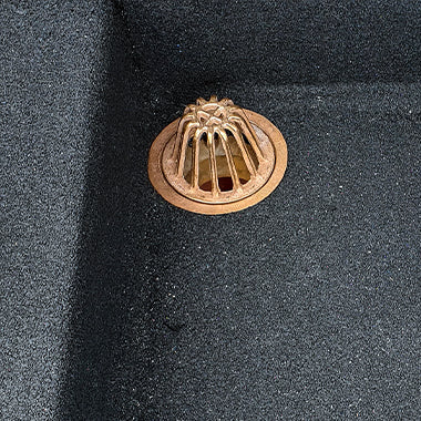 Bronze dome drain installed